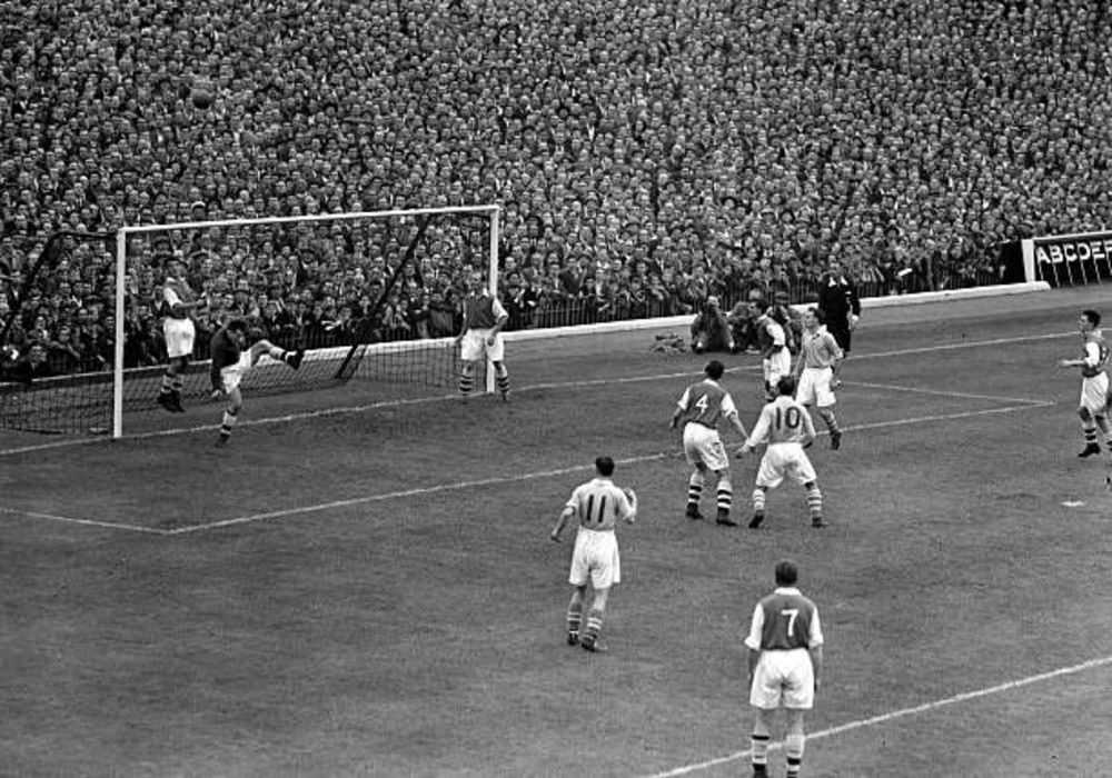 Joe Wade heading off the Arsenal goalline