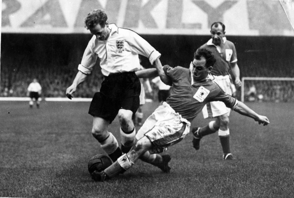Alf Sherwood tackling England`s Tom Finney