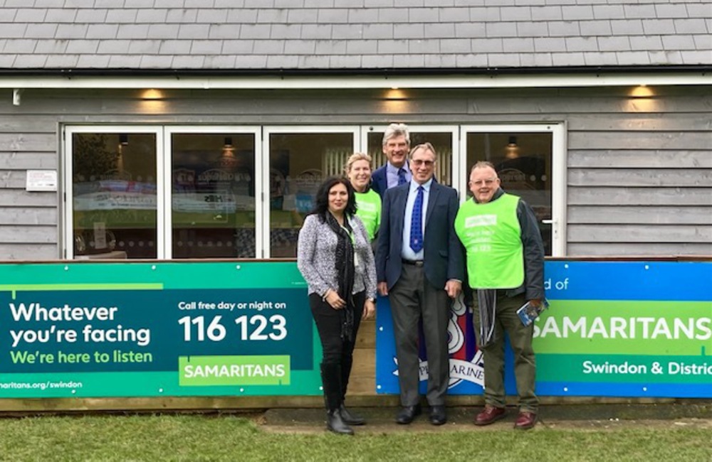 Samaritans volunteers alongside `Marine President Steve Moore (second from right) and the new advertising boards