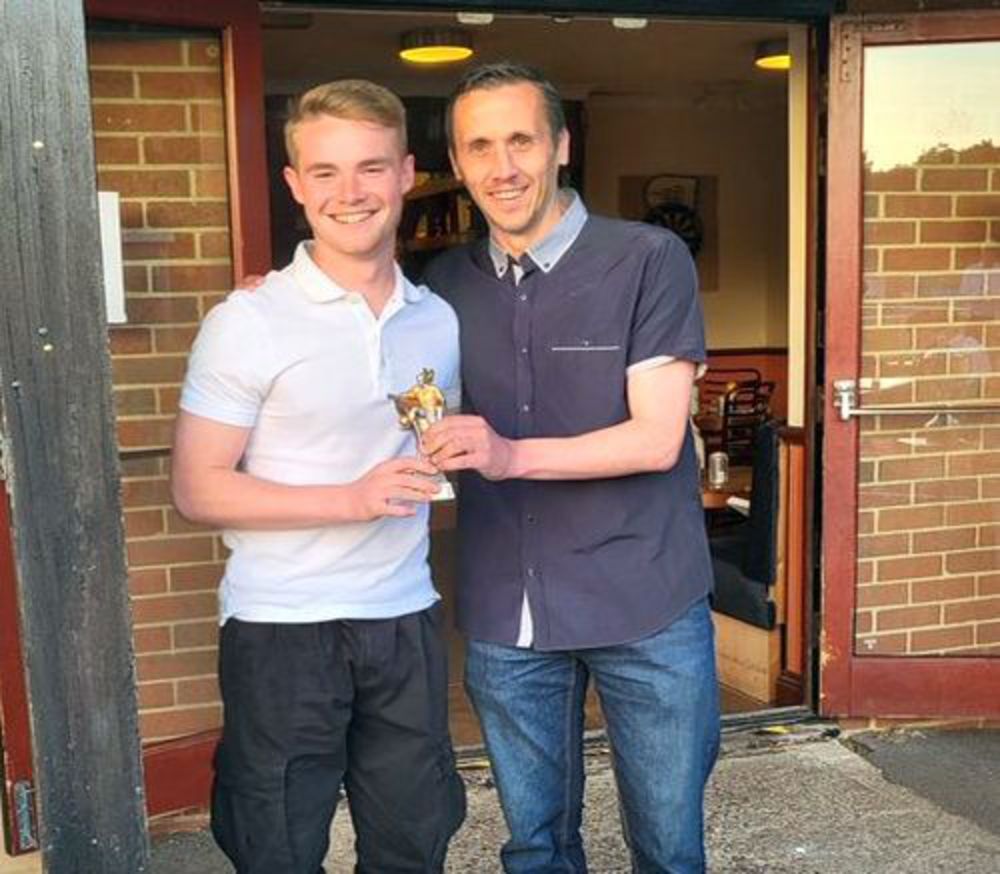 Charlie Philpott receiving his players` player of the year award