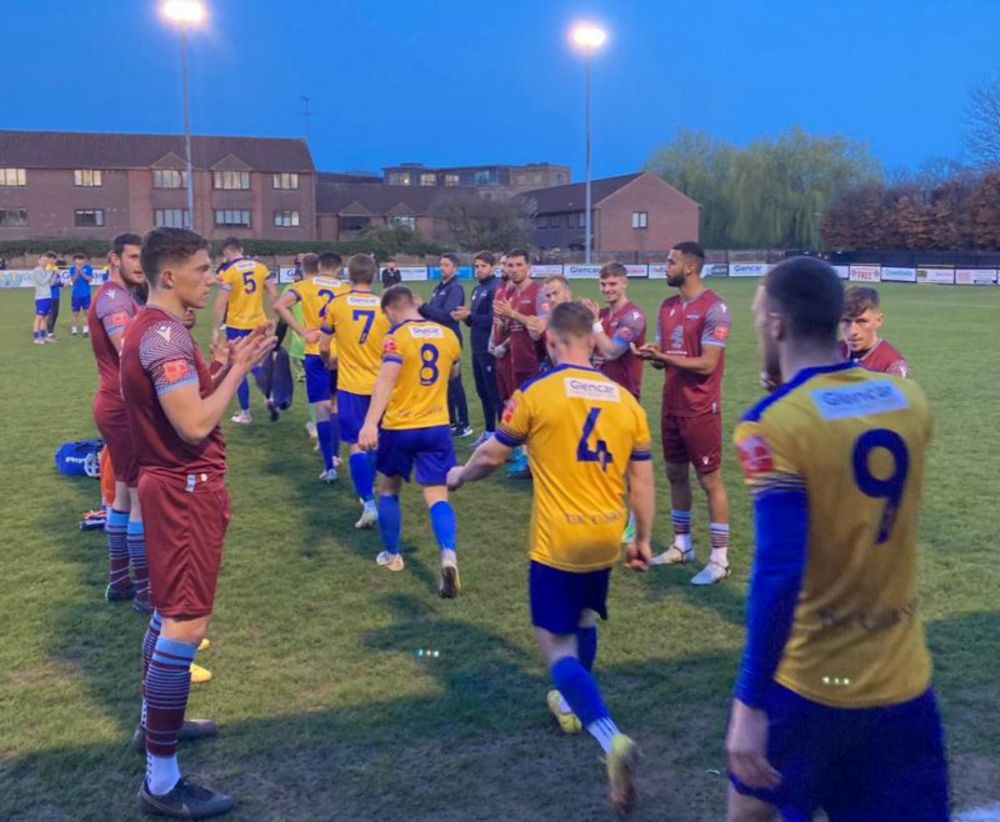 Nice gesture by Welwyn Garden City players as they clap the champions onto the field