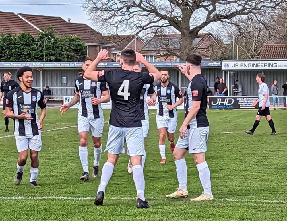 Sholing celebrate scoring at Willand Rovers (Photo Sholing FC)