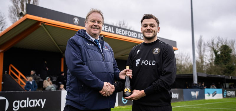 Real Bedford receive their PST Sport Club of the Month award for October 2024 from David Knight of the Southern League